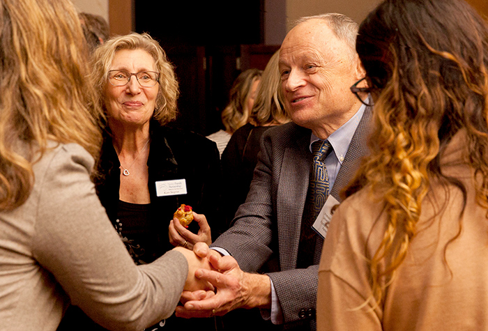 The bold Dr. David Olds shakes an attendees hand.